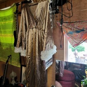 Gold gawdy dress with ruffles.
